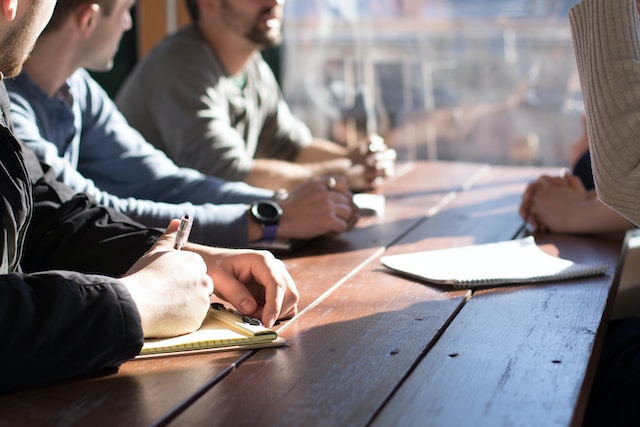 people sitting at a table during daytime