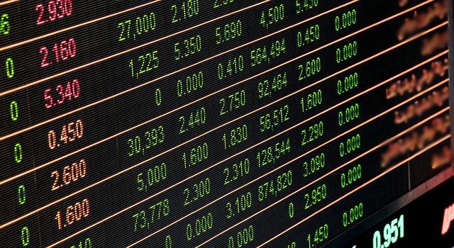 Financial data analysis graph showing stock market trends on a trading board.